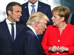 Left to right: French President Emmanuel Macron, Donald Trump and German Chancellor Angela Merkel