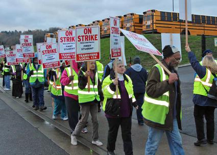 Striking school bus drivers walk the picket line in
        Seattle, Washington (Teamsters Local 174 | Facebook)