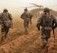 U.S. soldiers run toward Black Hawk helicopters after a search for weapons caches in Iraq (Spc. Luke Thornberry)