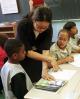 A teacher at P.S. 48 in Harlem works with students on reading skills  (Richard B. Levine | Showcase)