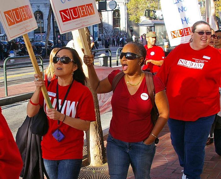 Members and supporters of the National Union of Healthcare Workers picket for home care workers in San Francisco