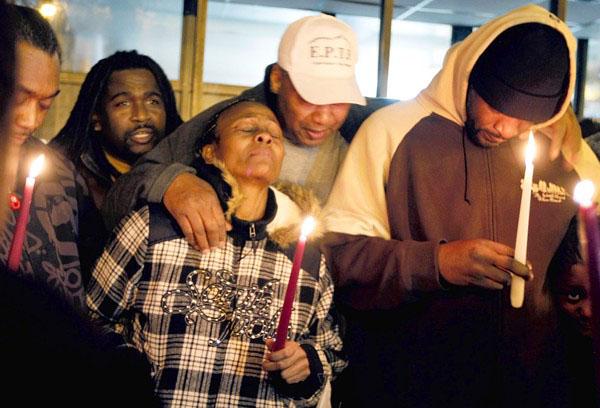 Friends and family hold a vigil for two teenagers shot in Chicago's Englewood neighborhood