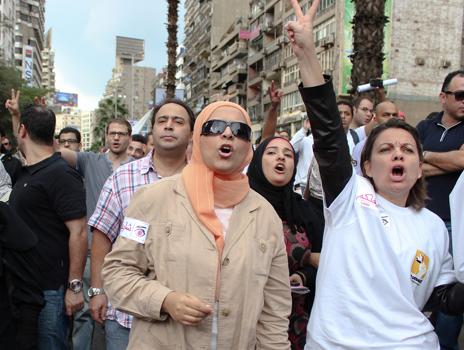 Protesters march to Tahrir Square following President Morsi's constitutional decree