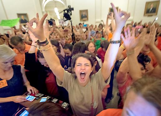 Protesters pack the Texas Capitol building to obstruct a vote on an anti-abortion bill