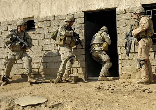 U.S. soldiers raid a home in Iraq