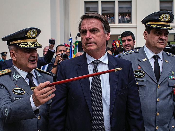 Far-right presidential candidate Jair Bolsonaro speaks with Brazilian generals