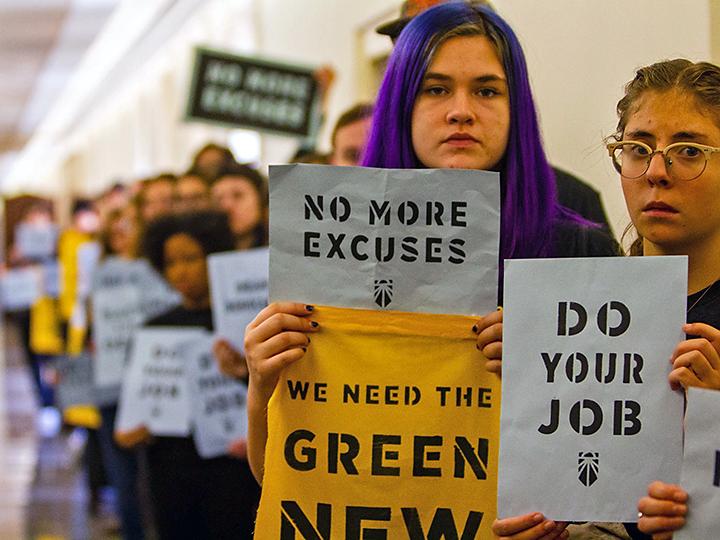 Protesters demand a Green New Deal outside the offices of leading House Democrats