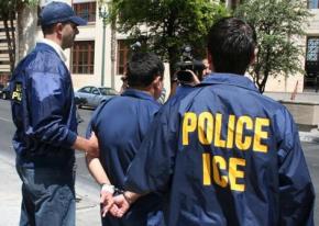 ICE agents with a detainee in El Paso