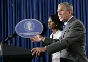 George Bush issues a statement on the Middle East while Secretary of State Condoleezza Rice looks on