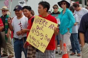 Protesters on the march against the raid in Postville, Iowa, ask about their missing relatives