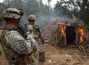 U.S. troops set fire to a suspected Taliban hideout along the Afghanistan-Pakistan border