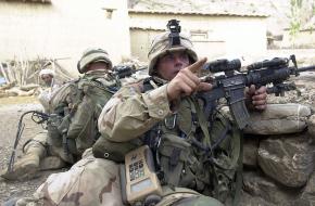 U.S. soldiers take up positions in the town of Gangikhel in southeastern Afghanistan