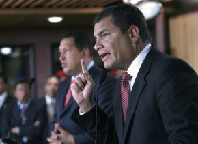 Ecuador's President Rafael Correa (right) speaks with Venezuelan President Hugo Chávez