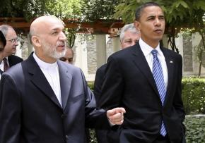 Barack Obama meets with Afghan President Hamid Karzai while on a visit to Afghanistan