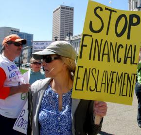 A woman in Gucci sunglasses protests her "enslavement" by taxation