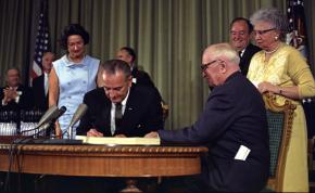 Lyndon B. Johnson signs Medicare into law in July 1965