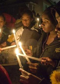A vigil for Kiwane Carrington near where he was killed