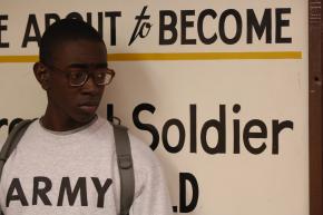 A new recruit to the Army waits in line during the intake process