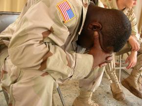 A U.S. soldier mourns the loss of a fellow soldier