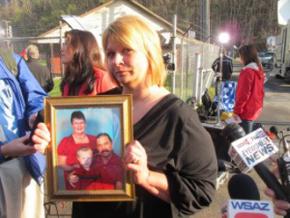 Michelle McKinney holds a photo of her father, Benny Willingham, killed in the explosion at the Upper Big Branch mine