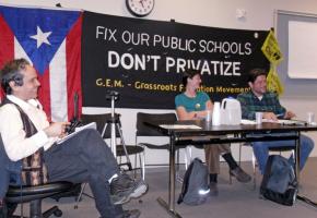 Puerto Rico teachers union head Rafael Feliciano (right) speaks alongside two members of New York City's Grassroots Education Movement