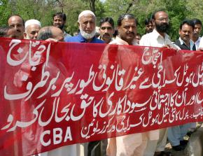 Workers protest outside the Pearl Continental Hotel near Islamabad