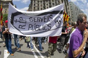 Public-sector workers and their supporters march in Barcelona during a one-day general strike to protest austerity