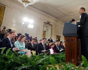 Members of the press listen attentively to President Obama during a White House press conference