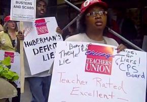 Members of the Chicago Teachers Union rally against layoffs in July