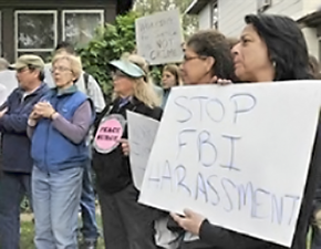 Minneapolis residents rally against an FBI raid on the homes of activists