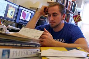 A student looks over his student loan statement