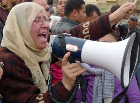 A woman leads chants against Hosni Mubarak in Tahrir Square