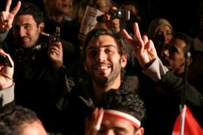 Protesters celebrate their victory as Mubarak is forced to step down