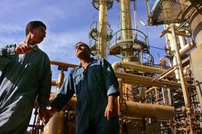 Iraqi oilworkers at a refinery outside Baghdad