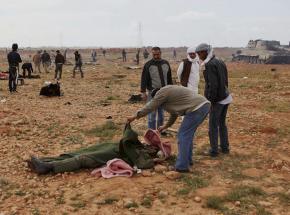 Libyans survey the damage and casualties from U.S.-led bombing