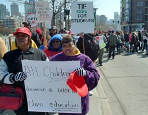 Chicago teachers march with parents and supporters against the diversion of city tax dollars from public schools