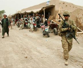 A U.S. soldier patrols a village bazaar in Northern Balkh Province in Afghanistan