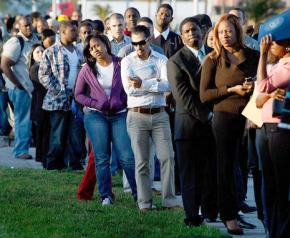 Job seekers wait in an endless line for a chance at work
