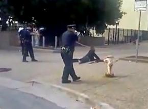 San Francisco police train their guns on Kenneth Harding as he bleeds to death
