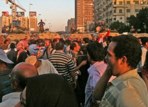 A mass march from Tahrir Square is blocked by military vehicles and soldiers