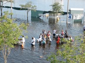 People attempting to flee New Orleans on foot after Hurricane Katrina struck