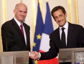 Greek Prime Minister George Papandreou shaking hands with French president Nicholas Sarkozy