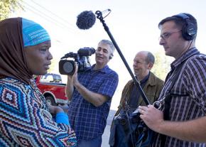 Camera crews film "interrupter" Ameena Matthews