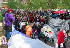 Hundreds of people poured into Liberty Plaza to defend it against a threatened eviction