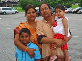 Ahmed Hossain with his wife and children