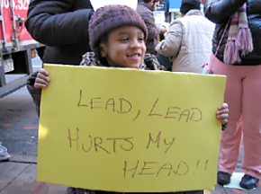 A child at a protest against lead-contaminated housing