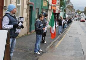 Protesters line the streets of Lurgan in defense of Irish republican political prisoners