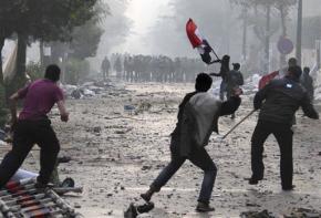 Protesters confront Egyptian military forces outside the Cabinet headquarters