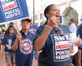 Postal workers protest proposed cuts during a nationwide day of action