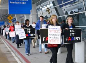 Union members at American Airlines picket outside the Dallas-Fort Worth airport